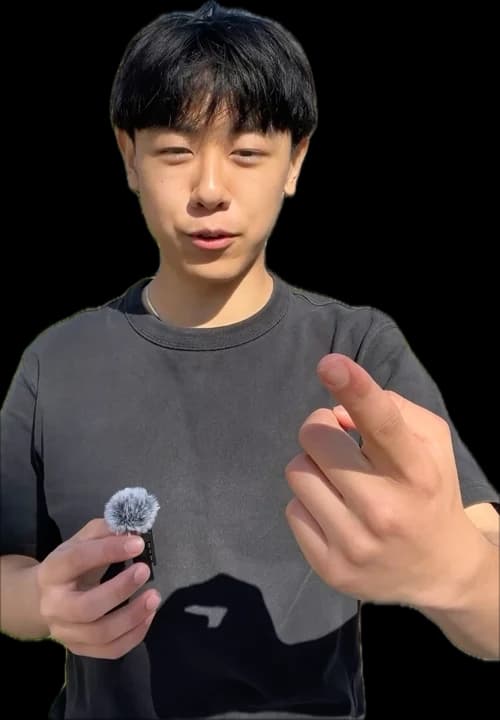 Me talking to camera outside, holding a mic