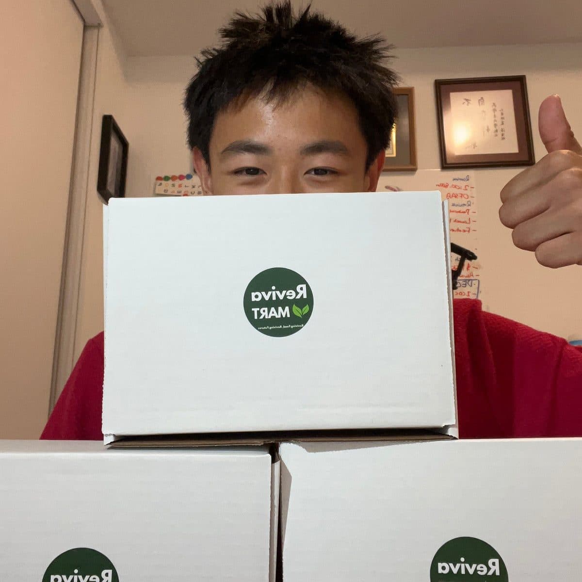 Brighton holding a Reviva Mart box