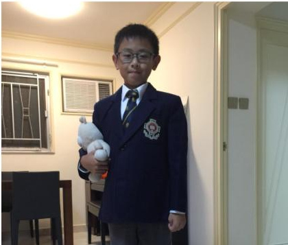 Me in my school uniform holding Brother